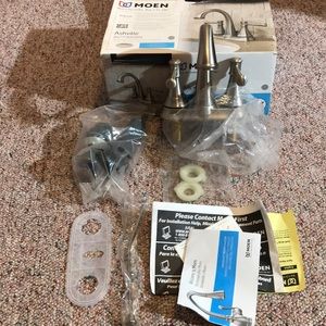 NIB Moen brushed nickel bathroom faucet an…